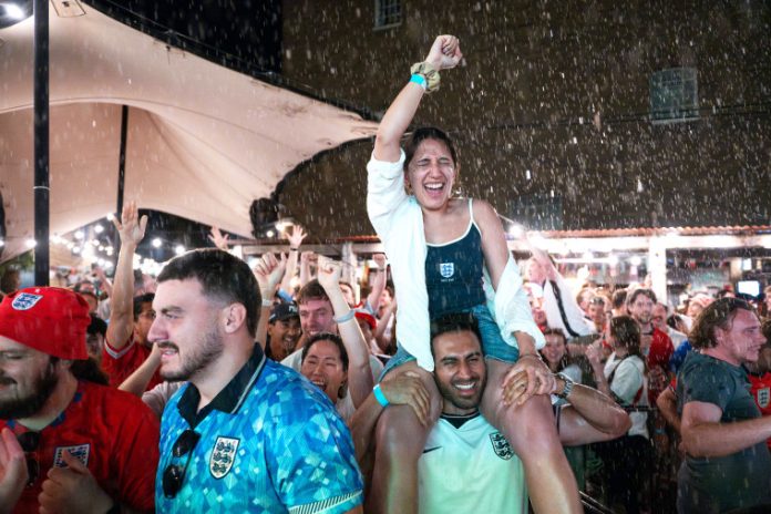 LONDON — Scotland fans famously drank Boston dry.
But while the team’s exploits on the field could not match the success of its supporters, pubs in England — some of which are struggling financially — have been boosted by the boon in beer sales from the team’s run to the World Cup semifinals.
England plays archrival Argentina in Atlanta on Wednesday, an 8 p.m. kickoff back home (3 p.m. ET) that will likely see fans flock to pubs across the country hoping to see their team make its first World Cup final in 60 years.
The profit made from the World Cup accounts for around 15% of the annual sales made by the Bread and Cheese pub in Thundersley, a small village around 40 miles east of London, owner Steve Haslam told NBC News in a telephone interview Tuesday.
He said he expected to make around 7,000 pounds to 9,000 pounds ($9,400 to $12,000) more than the average Wednesday, when England kicks off.
England fans in London celebrate the team’s quarterfinal win over Norway on Saturday. Thomas Krych / AP
And his pub is not alone. Around 5.5 million extra pints had been sold during group stages alone, according to UKHospitality, a trade body that represents the country’s hospitality and leisure sector.
Emma McClarkin, the CEO of the British Beer and Pub Association, said in an email Tuesday that it expected “Wednesday to be the most successful night of the tournament, with more than 6 million extra pints potentially sold,” around a 75% increase on the 8 million pints typically sold on an average Wednesday in July.
However, figures compiled by her organization and published in May show that 161 pubs across Britain closed between January and March, the equivalent of almost two a day.
Overall “margins are getting squeezed because it is a tough time for pubs right now,” said Haslam, the owner of the Bread and Cheese who is also director of Aim Pubs, a family business that owns eight pubs across the United Kingdom.
Having initially refused, the government did eventually relent and relax licensing laws for England’s second-round match against Mexico, allowing pubs to stay open until 5 a.m. local time.
An England fan in Liverpool on Saturday.Peter Powell / AFP via Getty Images
But both UKHospitality and the British Beer and Pub Association say lawmakers need to do more to protect the industry and blame high business rates and taxes as contributing factors to pub closures.
It’s a view shared by Ash Corbett-Collins, chairman of the Campaign for Real Ale or CAMRA.
The “government needs to fully recognize the contributions pubs make to the economy and social well-being of local communities,” he said. “We risk losing more and more pubs unless meaningful support is given.”
Fairer business rates and less tax on food and drink, including beer, would help out, he said. “The industry can’t rely on a sports tournament every four years to survive,” he added.
A spokesperson for Britain’s Treasury said the government was backing the hospitality industry by cutting taxes “on family attractions and kids meals this summer, reforming business rates, extending World Cup opening hours, and taking action on the cost of living to boost the sector.”
England’s Jude Bellingham celebrates after scoring against Norway.Patricia de Melo Moreira / AFP via Getty Images
The British government also announced in January that pubs and live music venues would be given a 15% discount on their business rates from April and not see increases for two years.
The British Beer and Pub Association said that this was “vital, but temporary” but a longer-term plan was required to “save pubs, jobs, and hearts of communities.”
And Haslam also said that the cut was largely ineffective and that he believed the government should revise the business and other taxes to help out.
“The great British pub is the heart of the country. People go to pubs to make memories. They’re social hubs doing so much good for the community,” he said. “Pubs have changed my life.”
This post appeared first on https://www.nbcnews.com