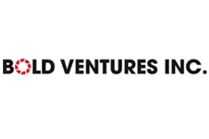 Investor Insight
Bold Ventures Inc. is a Canadian mineral exploration company poised for discovery. The company is advancing a portfolio of precious, battery, and critical metals projects in Tier-1 jurisdictions across Ontario and Quebec. Through systematic exploration and targeted acquisitions, Bold is positioned to meet rising global demand for gold, copper, nickel and critical minerals essential to North America’s electrification plans.
Overview
Bold Ventures (TSXV:BOL) is a Canadian mineral exploration company advancing a diversified portfolio of gold, copper, nickel and critical mineral projects across Ontario and Quebec, both consistently ranking among the safest and most mining-friendly in the world.
Bold’s balanced approach to both precious and critical metals aligns with two powerful global themes: the enduring demand for gold and silver as stores of value, and the accelerating transition to electrification and clean energy requiring copper, nickel and chromium.
Bold’s assets are concentrated in three prolific mining districts of Northern Ontario – Thunder Bay West, Wawa West and the James Bay Lowlands (Ring of Fire) – each offering significant exploration upside and logistical advantages.
Thunder Bay West hosts Bold’s most advanced gold and copper properties – Burchell, Traxxin and Wilcorp – within the geologically rich Shebandowan Greenstone Belt, home to multiple active and past-producing mines.
Wawa West, anchored by the Farwell gold-copper project, sits within a historically productive gold camp with strong indications of both precious and base metal VMS-style mineralization.
The Ring of Fire, in the James Bay Lowlands, is Bold’s long-term critical-mineral growth platform. The company’s Koper Lake project includes a carried interest in the Black Horse Chromite Deposit — one of North America’s most significant undeveloped sources of chromium — as well as substantial nickel, copper and PGE potential in the surrounding claim blocks.
Complementing this Ontario portfolio, Bold added two high-quality exploration-stage assets in 2024–2025: the Springdale East gold project near Red Lake, Ontario, and the Joutel gold and base metal project in Quebec.
Underpinning this portfolio is a leadership team with decades of exploration experience and direct involvement in three world-class discoveries — Eagle River, Windfall Lake and the Ring of Fire deposits. This record of success, combined with a pipeline of highly prospective targets now moving toward the drill stage, positions Bold Ventures to deliver steady exploration progress and value creation across a range of commodity markets.
Company Highlights
Bold Ventures explores for precious, battery and critical metals in Canada, with active exploration projects in the Thunder Bay West, Wawa West and James Bay Lowlands (Ring of Fire) regions.
The company’s flagship Burchell gold-copper project has advanced through new discoveries, sampling and mechanical stripping programs completed in 2025.
Bold holds a carried interest in the Black Horse Chromite deposit at Koper Lake, adjacent to Ring of Fire Metals’ Eagle’s Nest nickel-copper deposit – a key critical-minerals hub for Ontario.
Recent exploration success at the Wilcorp property revealed a new style of gold-silver-copper mineralization, adding significant upside potential.
The company also owns and continues to evaluate its Traxxin Gold, Farwell Gold-Copper, Springpole East Gold, and Joutel Gold-Base Metal projects.
Bold’s management and technical teams have participated in three world-class discoveries – Eagle River, Windfall Lake and the Ring of Fire deposits – providing deep operational and geological expertise.
Key Projects
Burchell Gold and Battery Metals Project
The Burchell property (242 claims covering 4,607 ha) lies about 100 km west of Thunder Bay, contiguous with Gold X2 Mining Inc.’s Moss gold project hosting the 6-Moz Moss Lake deposit.
Project Highlights:
<strong>Western Shebandowan Greenstone Belt: </strong>The Burchell project is located in the Western Shebandowan Greenstone Belt, a high-potential, active mineral belt containing copper, gold, silver, nickel, zinc, molybdenum and other minerals.
<strong>Contiguous with Significant Gold Property: </strong>The Burchell property is contiguous with Goldshore Resources’ Moss gold project. The Moss Lake gold deposit lies within a major 25 km NE-trending structural corridor which also hosts the past-producing North Coldstream Mine and the East Coldstream gold deposit.
<strong>Exploration permits were granted</strong> (Aug 2025) for line cutting, stripping, geophysical surveys and diamond drilling. Mechanical stripping and channel sampling of the 111 Zone and seven additional targets have been completed (Sept 2025). Drilling preparations are underway.
<strong>111 Zone Discovery:</strong> Sheared, silicified volcanics returned values up to 68 grams per ton (g/t) gold and 2.1 g/t gold over 0.5 m; anomalous zone 4.5 to 6.5 m wide and open along strike and depth.
<strong>Soil Geochemistry:</strong> MMITM soil survey identified gold, copper and molybdenum anomalies coincident with a magnetic low along strike of the Moss Trend.
<strong>New Showings:</strong> “Winter Gold” (952 parts per billion gold, 300 parts per million silver), “Moosehead Zone,” and other targets outline a 2.9 km discontinuous gold trend across the property.
<em><em>Burchell Property Major Showings and Land Position</em></em>
Traxxin Gold Project
The 100 percent owned Traxxin gold project is 130 km west of Thunder Bay and has 217 claims covering 4,043 hectares. The project has excellent existing infrastructure and is road-accessible, located between two major highways, cutting down on future development costs.
Project Highlights:
<strong>Close Proximity to Significant Gold Deposit:</strong> The project is 40 km east of Agnico Eagle’s Hammond Reef deposit, which contains 5.6 Moz of gold at 0.71 g/t, including reserves, measured and indicated.
<strong>Promising New and Historical Exploration Results:</strong> The 2021 drill hole campaign results indicated 3.6 g/t gold over 12.3 meters, including 6.13 g/t gold over 4.88 m.
<strong>A joint venture with Lac des Mille Lacs First Nation</strong> (LDMLFN) continues to advance the project.
<strong>Future plans</strong> include geophysical extension of the Main Zone northward and testing southern targets.
Farwell Gold-Copper Project
Located 55 km NW of Wawa, the 6,440-hectare Farwell project hosts gold-bearing quartz veins and base-metal VMS-style mineralization. Recent VTEM and magnetic surveys identified multiple targets for follow-up drilling. Geological and geophysical modelling was completed in 2025 to refine priority zones for testing in 2026.
Project Highlights:
<strong>Promising Geological Formations: </strong>The claim group hosts gold-bearing quartz veins located within an iron formation that stretches along the western extensions of a major deformation zone. Additionally, there is base metal volcanogenic massive sulphide (VMS) style mineralization of copper, zinc, lead and silver. The property also features deformed ‘Timiskaming’ style conglomerates along the gold mineralizing trend (similar to Kirkland Lake, Geraldton).
<strong>Exploration Highlights and Future Drill Targets:</strong> A VTEM survey has identified multiple anomalous areas for future drilling. Additional results and interpretation were incorporated into the existing database for future exploration and drill testing.
<strong>Nearby existing infrastructure:</strong> Less than 2 km west of the Eagle River gold mines haulage road and is located approximately 6 km from the Eagle River Mill complex that also connects to major highways.
Wilcorp Gold Project
The Wilcorp property spans 264 ha with 18 staked and four patented claims. The project is located 17 km south of Hammond Reef and 32 km west of Traxxin.
Project Highlights:
<strong>Historical Results:</strong> The Eagle prospect area has significant historical gold discoveries. Maps from 1946 indicate values up to 11.1 g/t gold over 4.1 m including 30.8 g/t gold over 0.8 m in core (unsubstantiated in the modern era). Recent values include up to 16.3 g/t gold in an area where 1990s drilling returned 1.8 g/t gold over 7.6 m.
<strong>Sampling Results:</strong> In 2012, 62 grab samples ranged from <5 ppb gold up to 14,403 ppb gold (14.4 g/t gold), and in 2024, 39 grab samples ranged from <5 ppb gold up to 16,300 ppb gold (16.3 g/t gold).
<strong>Geological Setting:</strong> The property is proximal to the Quetico Fault, a major east-west fault zone. Gold mineralization is hosted in shear zones in volcanic and dioritic rocks which are subparallel to the Quetico Fault.
Koper Lake Project (Ring of Fire)
The Koper Lake property (1,024 ha) is one of Bold’s long-term critical-metal assets, located within 300 m of Ring of Fire Metals’ Eagle’s Nest nickel-copper deposit.
Project Highlights:
<strong>Multiple Commodity Streams: </strong>The Koper Lake project has significant potential for critical minerals, with potential to develop battery metals, chromite and precious metals for multiple revenue streams.
<strong>Black Horse Chromite Deposit:</strong> NI 43-101 inferred resource of 85.9 Mt grading 34.5 percent Cr₂O₃ (at 20 percent cut-off). Bold owns a 10 percent carried interest through to production in chromite, and a 40 percent working interest in all other metals, with a right of first refusal on a 1 percent NSR.
<strong>All Other Metals Ownership Interests</strong>: Bold 40 percent working interest, KWG 60 percent working interest; Bold has option to earn up to 80 percent working interest leaving KWG with a 20 percent working interest.
Ring of Fire Claims
The Ring of Fire asset is a future key project that will be given further attention as the Ring of Fire regional infrastructure and First Nation agreements are developed.
Project Highlights:
The Ring of Fire Claims project is a grassroots exploration project that has significant potential targeting the battery metals nickel, copper and platinum group elements.
Bold carried out a VTEM airborne survey in 2013 that located numerous geophysical anomalies that are prospective for battery metals.
Further exploration is pending the development of access, infrastructure and First Nation agreements.
Springpole East Gold Project
The Springpole East gold project covers 4,180 hectares across 208 single-cell claims, located about 120 km east-northeast of Red Lake and 9 km east of First Mining Gold’s 4.9-million-ounce Springpole deposit. The property directly adjoins First Mining’s land package, placing Bold within the same gold-bearing structural corridor that hosts Springpole. Recent exploration by previous operators identified angular granitic boulders returning 191 to 1,270 ppb gold and mapped banded iron formations corresponding to strong magnetic anomalies in the northwest part of the property. Despite its highly prospective setting, the area remains underexplored, providing Bold with an opportunity for first-pass systematic fieldwork, including lake-sediment sampling and targeted prospecting planned for 2026.
Joutel Gold and Base Metal Project
The Joutel gold and base metal project comprises 41 mineral claims across 2,269 hectares in two claim groups, located about 140 km northwest of Val-d’Or and 6.5 km south-southeast of the former mining town of Joutel. The property lies within an established polymetallic belt that hosts the historic Joutel gold and base-metal mines and the nearby Explo-Zinc deposit. Bold first worked the area in 2012, conducting VTEM and magnetic surveys that outlined multiple untested anomalies. Historical drilling in the vicinity returned encouraging results, including 0.83 percent nickel over 3.7 m (1.27 percent nickel over 2.3 m sub-interval) and 0.51 g/t gold over 3.05 m, confirming the project’s nickel-gold-zinc polymetallic potential. Planned next steps include soil sampling and reconnaissance prospecting to refine Phase I drill targets in 2026.
Management Team
David Graham – Chief Executive Officer and Director
David Graham has been active in the mineral exploration industry for over 40 years. Between 1997 and 2004 he was co-founder, president and CEO of Normiska Corporation, an industrial minerals and materials company with four production facilities in Canada and the US.
Between 2006 and 2010 he was a director and vice-president of Noront Resources. During this time the company made major discoveries at Windfall Lake in Urban Twp., Quebec and the Ring of Fire in the James Bay Lowlands of Ontario. Graham has worked extensively in Canada as well as in the US, Scandinavia and Africa. His experience has frequently included working with First Nations and regulatory agencies on projects that ranged from a grassroots stage to advanced development.
Bruce MacLachlan – President and Chief Operating Officer
With over 40 years of experience in the exploration industry, Bruce MacLachlan is a proven exploration manager and has been a key member of a number of mineral discovery teams, including Noranda Exploration, Battle Mountain Gold, CanAlaska Uranium and Noront Resources. He was a prospector at Noranda Exploration and Battle Mountain Gold, exploration manager at CanAlaska Uranium and Noront Resources. He is a co-founder and president of Emerald Geological Services (EGS), a consulting company created in 2001.
Coleman Robertson – Vice-president of Exploration
Coleman Robertson is a professional geologist who has worked exploring for gold, base metals and rare earth elements. His experience includes a wide range of exploration activities from grassroots to discovery stage projects. Employed by EGS since 2017, Robertson is vice-president of exploration for EGS and has experience with multiple projects in multiple jurisdictions, including Bold’s gold and copper projects in Northwestern Ontario and EGS’s high grade Cu-Ag-Pb-Zn-Au-Co project in Nunavut.
Robert Suttie – Chief Financial Officer
Robert Suttie currently serves as CFO with over 40 years’ experience as a consultant raising capital for emerging companies. He has been a director/executive at several private/public corporations.
William Johnstone – Corporate Secretary and Legal Counsel
William Johnstone is the company’s corporate counsel and corporate secretary. Johnstone has been a partner at Gardiner Roberts LLP since February 2005, practicing in the areas of corporate and securities law for over 40 years.
Ian Bodie-Brown – Director
Ian Bodie-Brown is an industry consultant with over 35 years’ experience. He is chairman of Rio Silver (on the TSX Venture Exchange) and a professional geologist.
Steve Brunelle – Director
Steve Brunelle is a professional geologist with over 35 years’ experience and is the chairman of Rio Silver (on the TSX Venture Exchange).
This post appeared first on investingnews.com